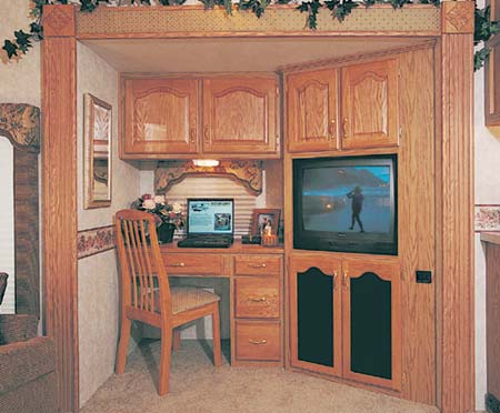 The 34.5 RLTG in Spice Decor. Desk/Entertainment Center - Work station for your computer - TV viewing from every seat - Full AM/FM/CD/Cassette Stereo System.