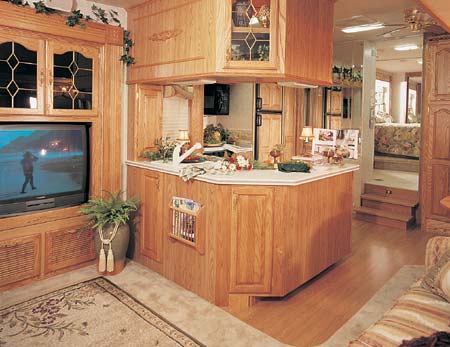 This 35 Quad Glide, in Dream Green designer decor, shows a beautiful entertainment center with 32