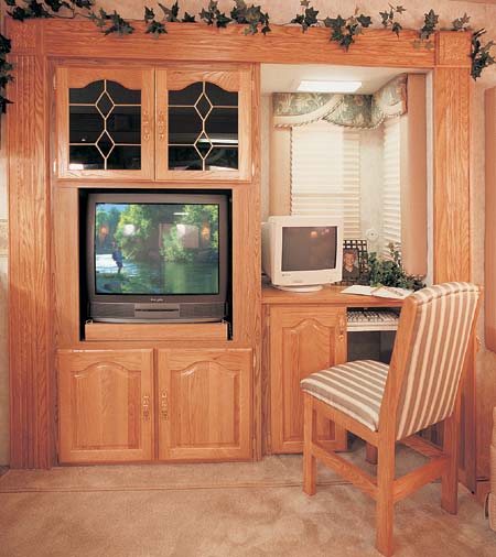 This 34+2 SK in Jade decor has an entertainment center that includes a 27